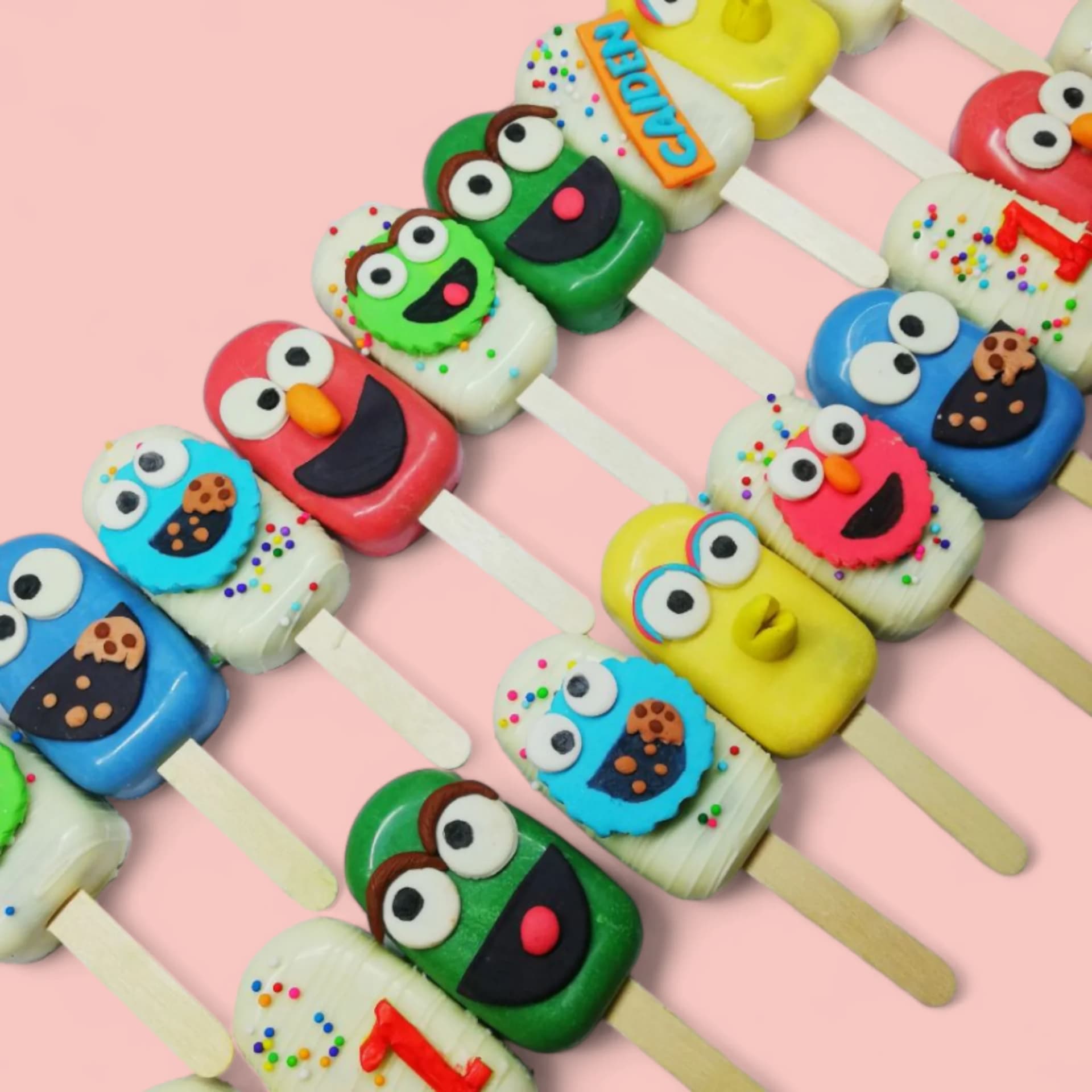 Sesame Street-Themed Cakesicles by Love Bites Cake Hub