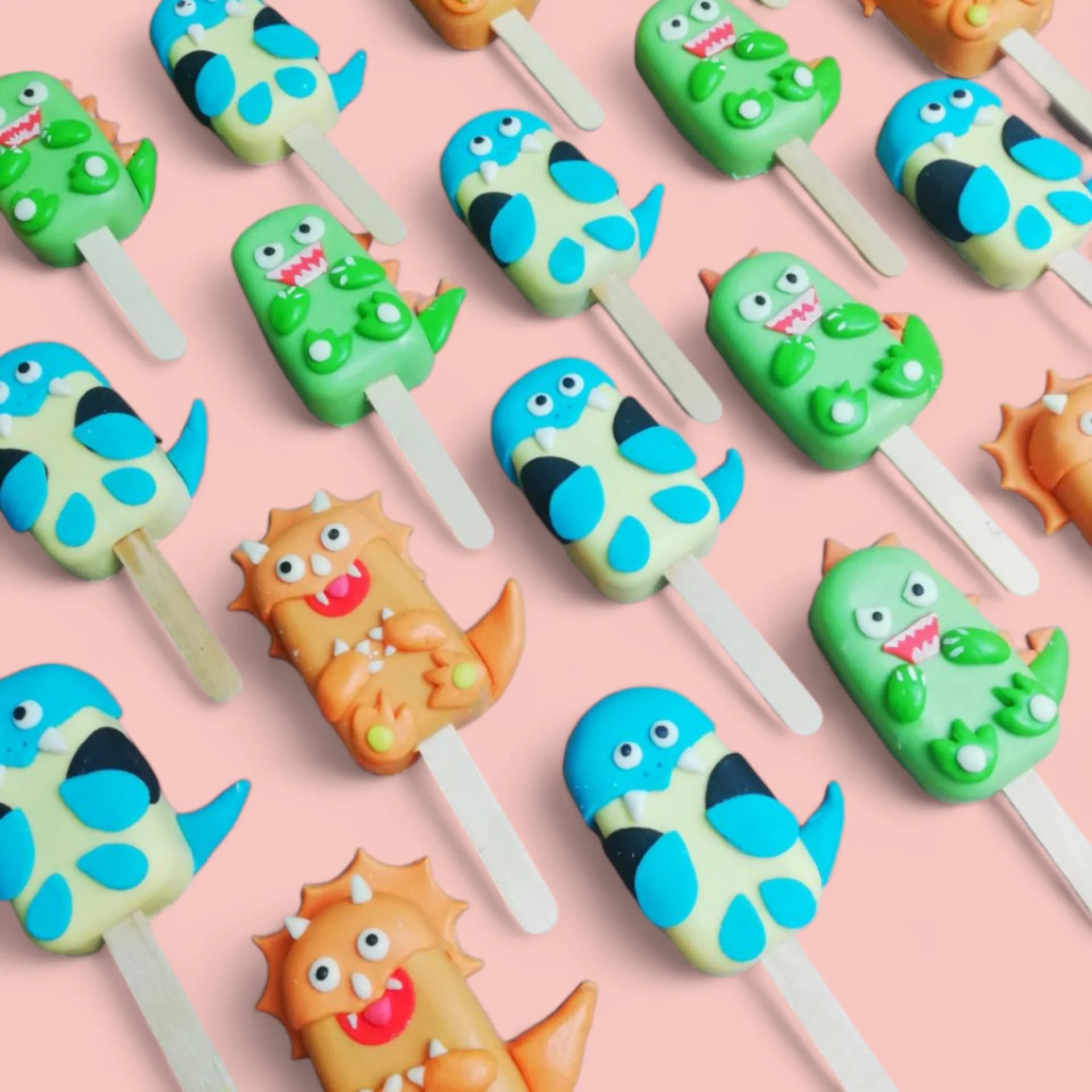 Dinosaurs-Themed Cakesicles by Love Bites Cake Hub