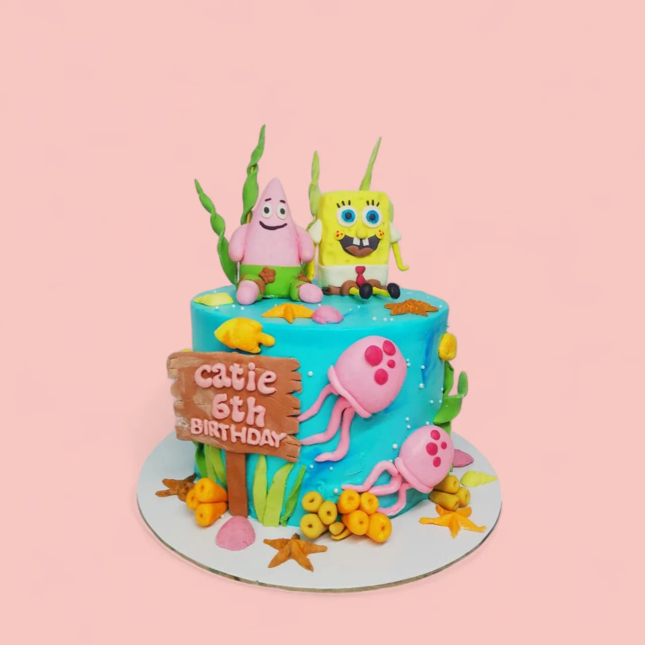 Custom SpongeBob-Themed Birthday Cake with Fondant Details by Love Bites Cake Hub