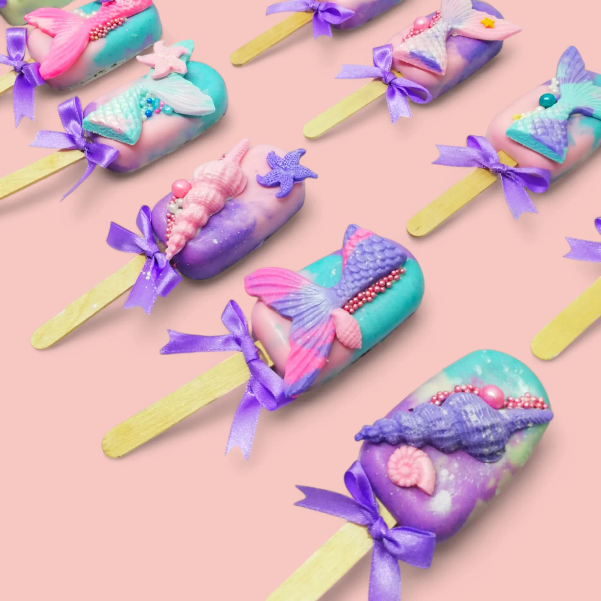 Mermaid-Themed Cakesicles by Love Bites Cake Hub