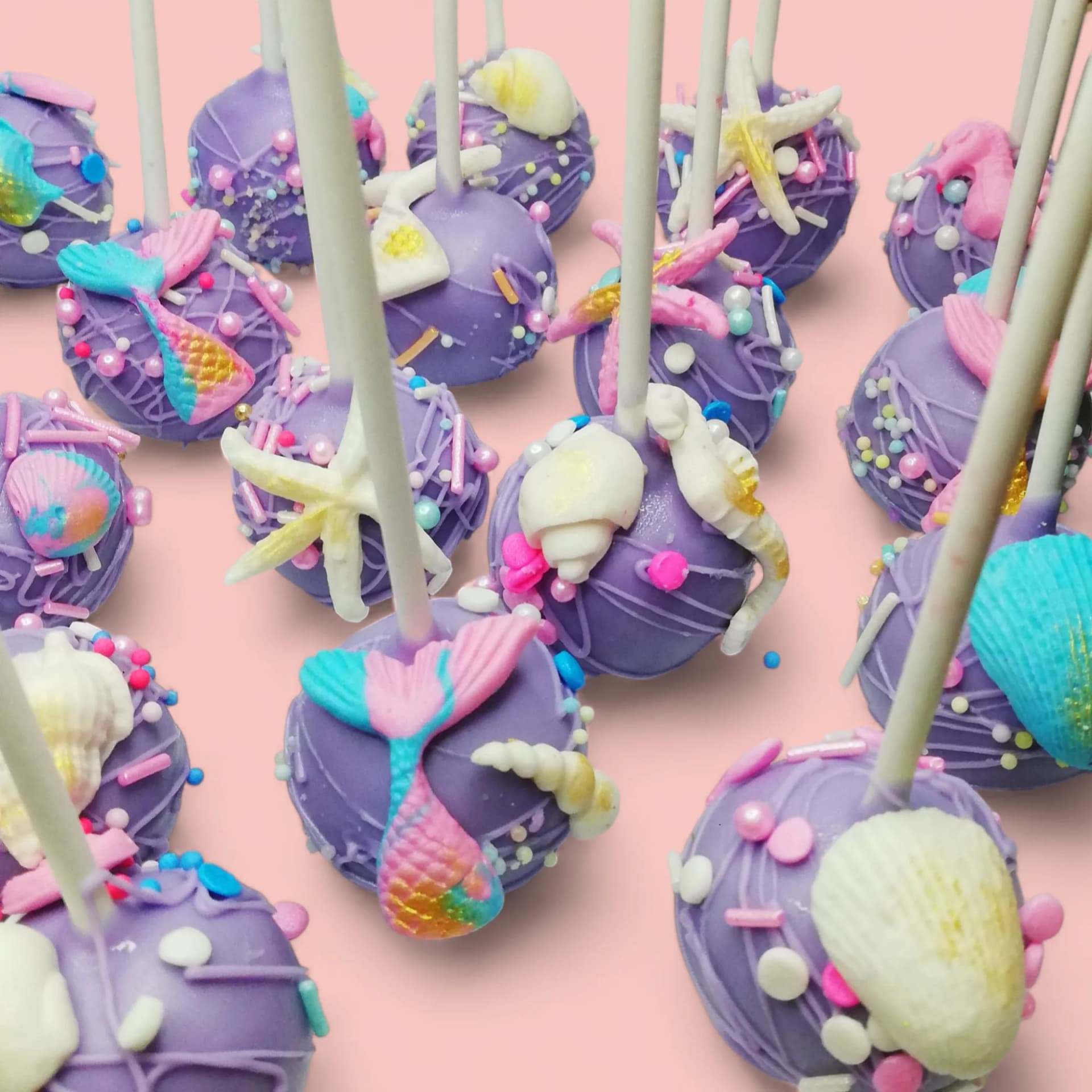 Mermaid-Themed Cake Pops by Love Bites Cake Hub